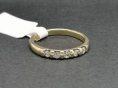 Five stone diamond ring, round brilliant cut diamonds, bar set in 9ct yellow gold, and stamped 0.