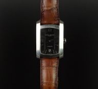 GENTLEMEN'S BAUME AND MERCIER WRISTWATCH, rectangular black dial with arabic numerals and a date