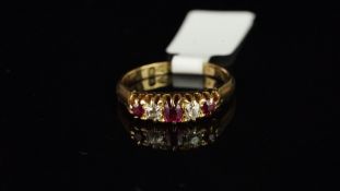Victorian ruby and diamond carved half hoop ring, mounted in hallmarked 18ct yellow gold, dated