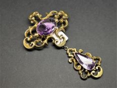 Antique large amethyst drop brooch, mounted in unmarked yellow metal, set with an oval amethyst to