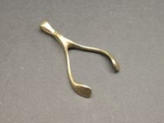 9ct yellow gold wishbone pendant, gross weight approximately 3.1 grams.