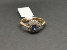 Sapphire and diamond cluster ring, mounted in hallmarked 18ct yellow gold, central round sapphire