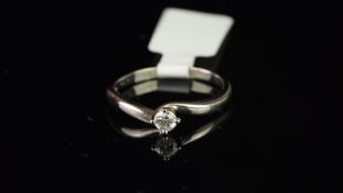 Single stone diamond ring, mounted in unhallmarked white metal stamped 750, set with a round
