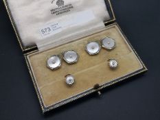 Set of mother of pearl cufflinks and two dress studs, mounted in yellow and white metal stamped '
