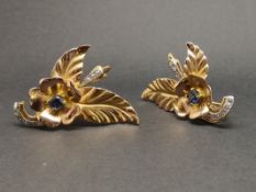 Pair of large sapphire and diamond floral design earrings, mounted in yellow metal stamped with