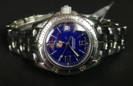 LADIES' TAG HEUER PROFESSIONAL WRISTWATCH, circular blue dial with thin silver hour markers and a