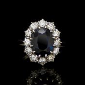 Sapphire and diamond cluster ring, 11.3 x 9.1mm oval cut sapphire, estimated weight 4.45ct, set with