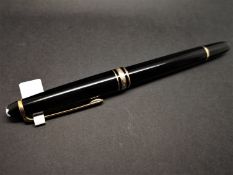 Mont Blanc black lacquer and yellow metal ballpoint pen, needs refill.