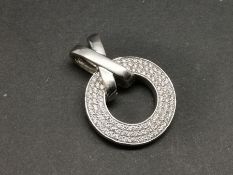 Diamond circle pendant, mounted in white metal stamped with French eagle's head, also stamped .43,