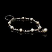 Pearl and diamond bracelet, designed as alternating links of rose cut diamond set bows and single