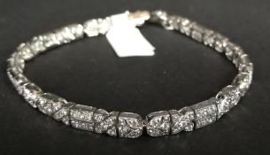 A diamond set bracelet, geometric design set with round brilliant cut diamonds, with an estimated