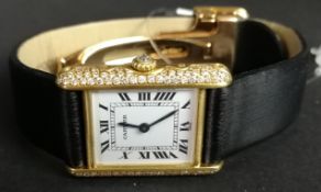 LADIES' CARTIER 18K GOLD DIAMOND FACTORY SET WRISTWATCH, rectangular white dial with Roman