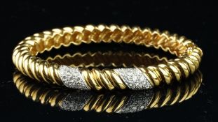 Tiffany & Co diamond set bangle, oval clasp bangle, in a twisted rope design, with two panels of