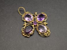 Antique amethyst wire work pendant, mounted in unmarked yellow metal, set with four oval amethysts