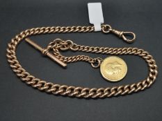 An antique 9ct yellow gold Albert chain, with a George V half sovereign, gross weight
