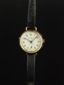 LADIES' SNOWDON MANUAL WIND WRISTWATCH, circular 28mm gold case, off-white dial, Arabic numbers,