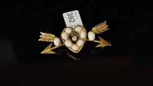 A shell and diamond heart and arrow brooch, central old cut diamond, weighing an estimated 0.10ct,