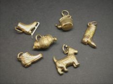 Selection of six yellow metal charms, stamped, tested or hallmarked 9ct, gross weight