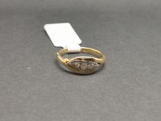An antique three stone diamond ring, set in 18ct yellow gold, ring size K.