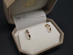 Ruby and diamond half hoop earrings, alternating round cut rubies and round brilliant cut