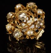 A pearl and diamond brooch, set with five rose cut diamonds and four half pearls, mounted in