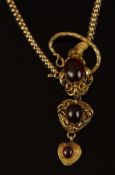 A Victorian garnet set snake necklace, designed as a cabochon garnet set to the snakes head
