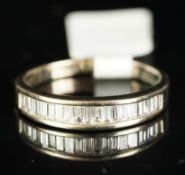 Diamond half eternity ring, tapering baguette cut diamonds, channel set in yellow metal, finger size