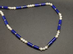 Pearl, gold and lapis lazuli necklace, designed as a repeating pattern of three pearls and two
