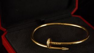 Diamond set bracelet, set in 18ct yellow gold, in the form of a coiled nail, with a concealed