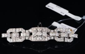 Art Deco diamond set brooch, set with old cut and single cut diamonds weighing an estimated 4.