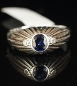 Sapphire and diamond gypsy set ring, mounted in white metal stamped 585, single oval sapphire rub-