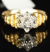 Vintage diamond cluster ring, mounted in hallmarked 18ct gold, seven round diamonds set to central