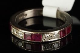 Ruby and diamond half eternity ring, designed as alternating two round brilliant cut diamonds and