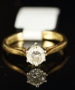 Single stone diamond ring, round brilliant cut diamond, set in 18ct yellow gold, stamped .52