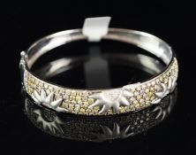 Diamond set bangle, wide diamond set panel with sun detail, set with yellow and white round