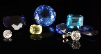 Selection of eight loose stones including synthetic sapphire, quartz, topaz and zircon, a mixture of