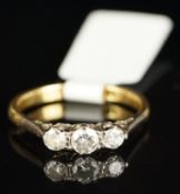 Three stone diamond ring, mounted in yellow and white metal stamped 18ct Plat, three round brilliant