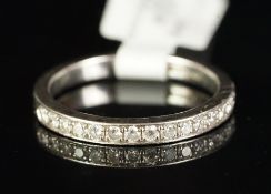 A diamond set half eternity ring, round brilliant cut diamonds, set in platinum, finger size M,