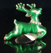 Novelty deer ring, green in colour with paste set collar, in yellow metal, adjustable band,
