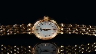 LADIES' ROTARY COCKTAIL WATCH, oval white dial with rose gold hour markers and dauphine hands,