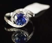 Sapphire and diamond round twist design ring, mounted in white metal with partial marks, inside