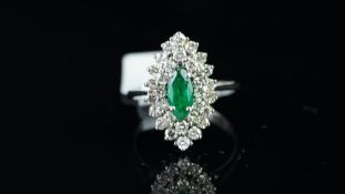 Emerald and diamond tiered marquise shaped dress ring, central marquise cut emerald set with two
