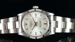 GENTLEMEN'S ROLEX OYSTER PERPETUAL DATE, REF. 1501, SILVER DIAL, ENGINE TURNED BEZEL, CIRCA. 1968,