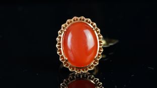 Single stone cornelian ring, mounted in unmarked yellow metal tested as 18ct gold, oval cabochon