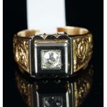 A gentlemen's single stone diamond ring, central old cut diamond, mounted in white metal on a yellow