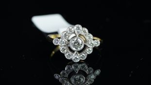 Art Deco style diamond cluster ring, mounted in yellow metal stamped 18ct, central round brilliant