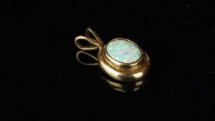 Synthetic opal pendant, mounted in 9ct gold, approximate weight 2.1 grams.