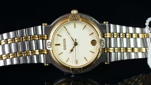 LADIES' GUCCI WRISTWATCH, circular cream dial with gold hour markers and hands, date aperture at