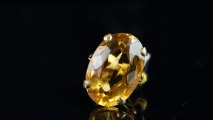 Single stone citrine ring, mounted in unmarked yellow metal tested as 9ct gold, large oval mixed cut