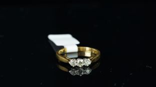 Three stone diamond ring, mounted in hallmarked 18ct yellow gold, inside shank stamped '.25',